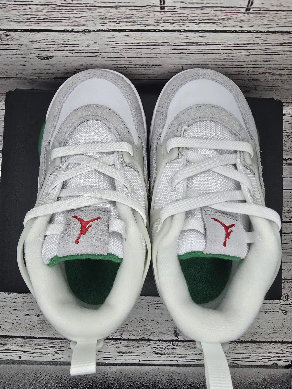 Jordan 4 RM Kids' White and Gray Athletic Sneakers with Green Accents